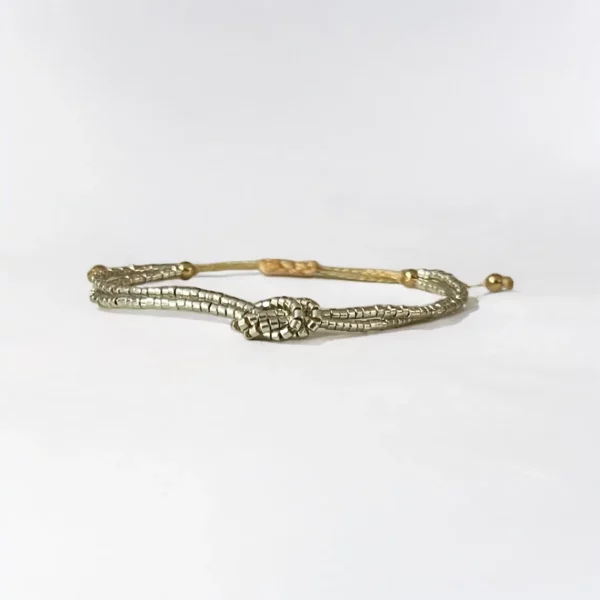 Gold and silver snake bangle bracelets.