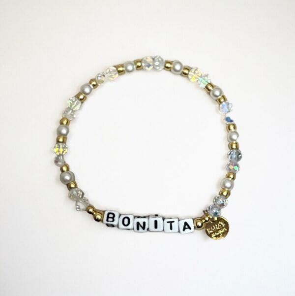 Beaded bracelet with "BONITA" and gold charm.