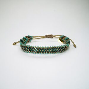 Turquoise beaded bracelet on white background