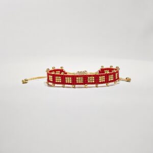 Red and gold beaded bracelet on white background