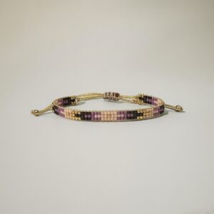 Handmade beaded bracelet with adjustable gold clasp.